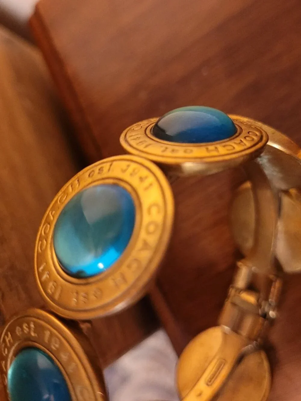 Coach Brass & Gemstone/Glass Cabochon Medallion Hinged Bangle Bracelet Blue